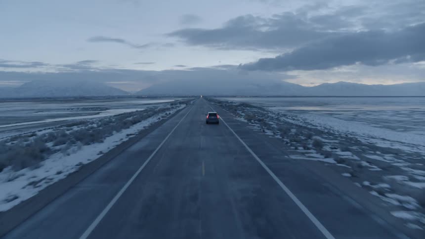 Car drives on a rural road