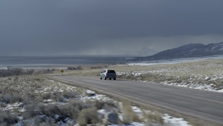 A car travels on a rural road
