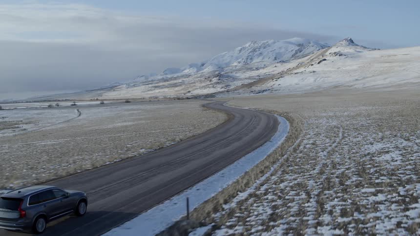 A car travels on a rural road