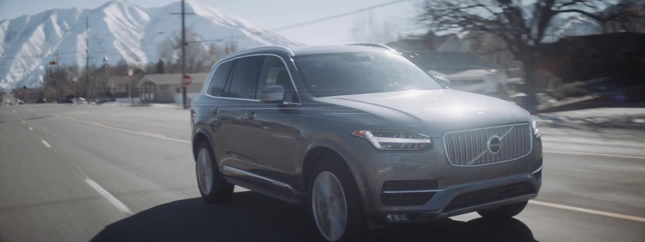 An suv is driven on a town road