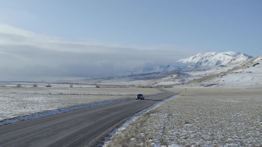 A car travels on a rural road