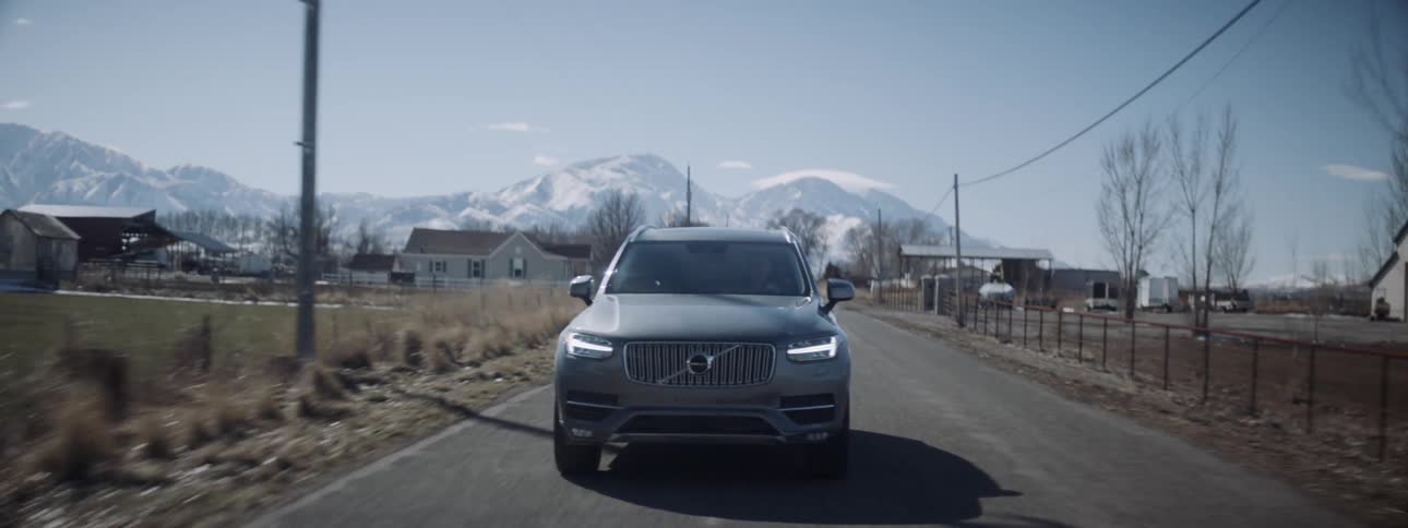 A car drives on the rural road