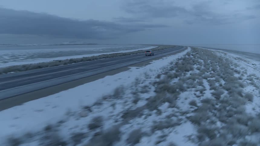 A car travels on a rural road
