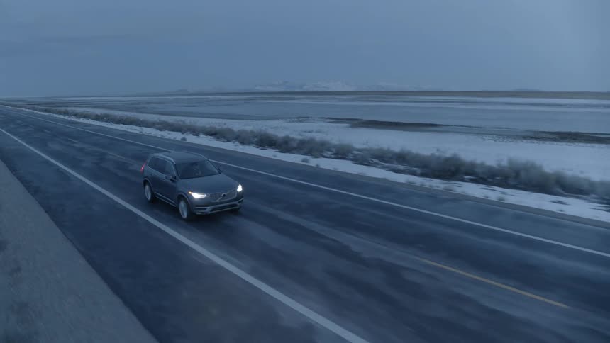 A car travels on a rural road
