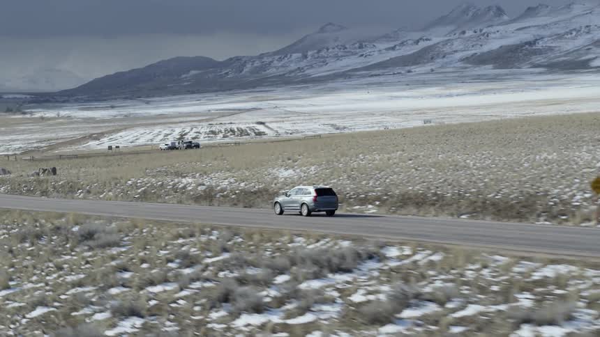 A truck drives on a rural road