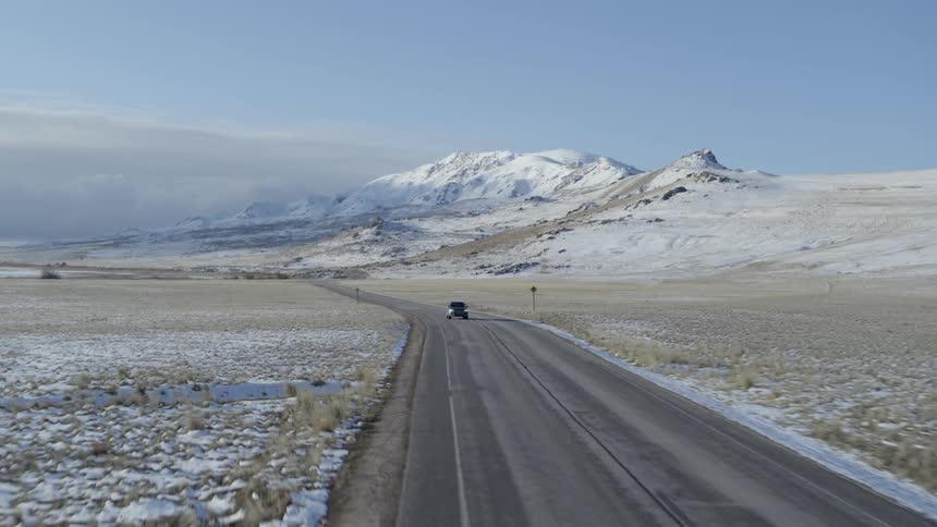 A car travels on a rural road