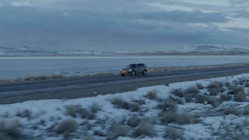 A vehicle travels on a rural road