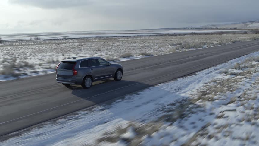 A car travels on a rural road