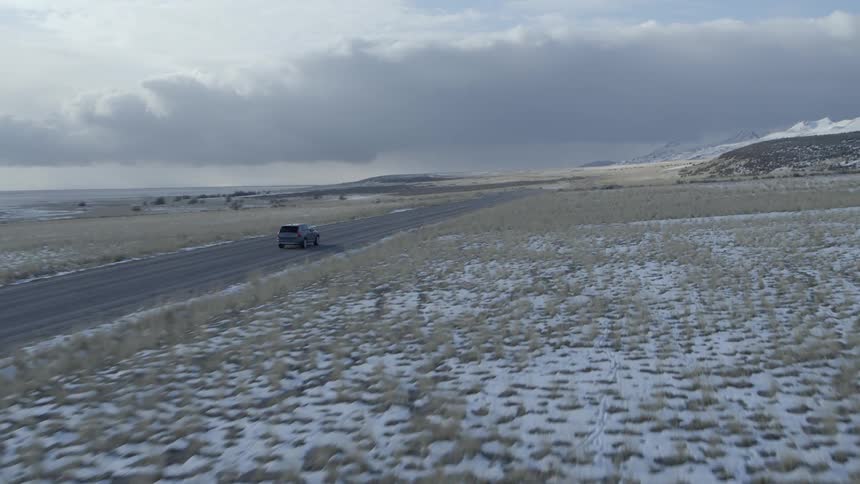 A car travels on a rural road