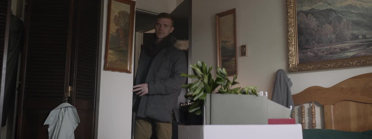 Man enters room and looks around