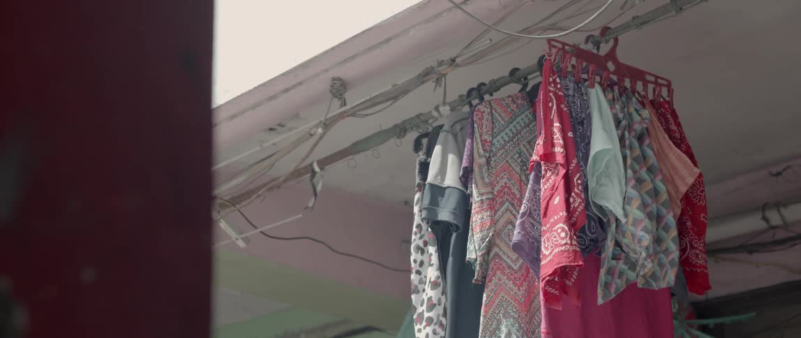 Clothes hang to dry outside of apartments