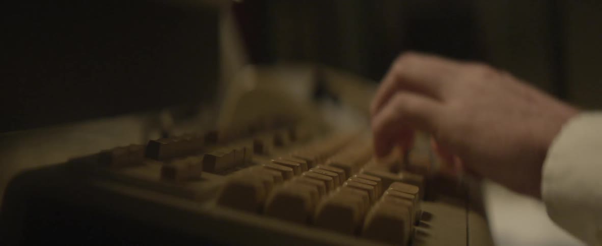 Hand typing commands onto an old keyboard