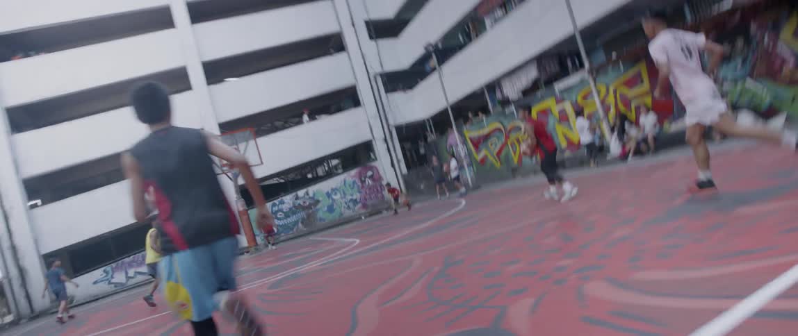 Young kids play basketball together
