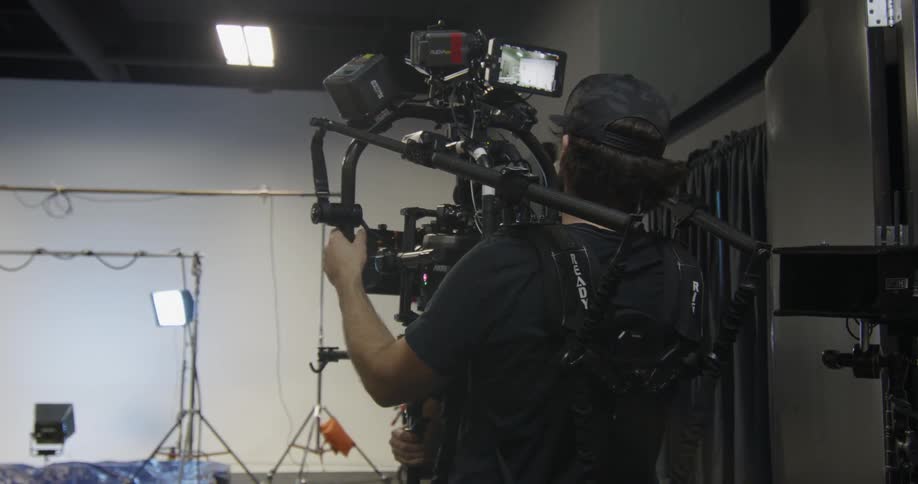A film crew works in a studio