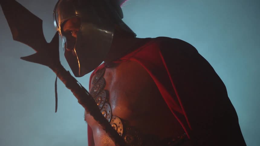 Smoke swirls around a gladiator
