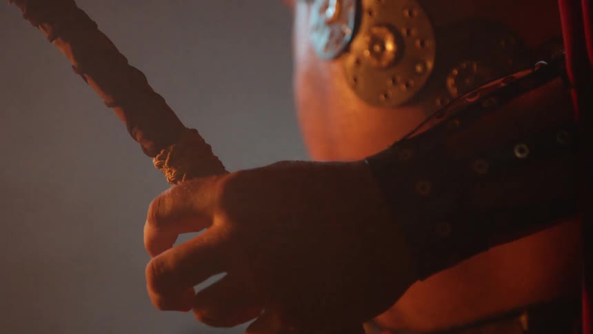 Person holds onto a stick in shimmering light