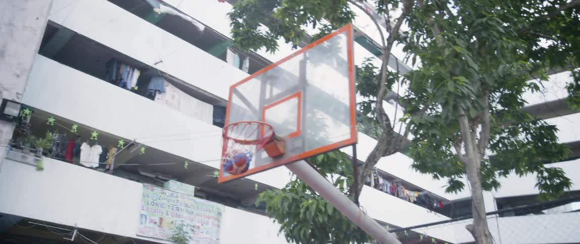 Young kids play basketball together