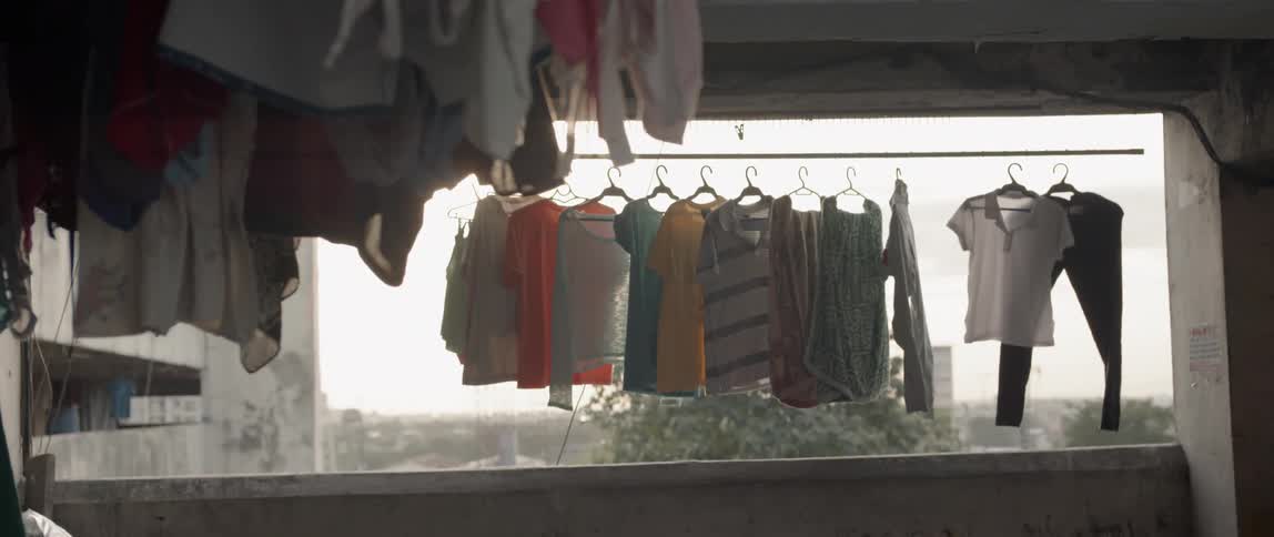 Laundry hangs on an apartment balcony