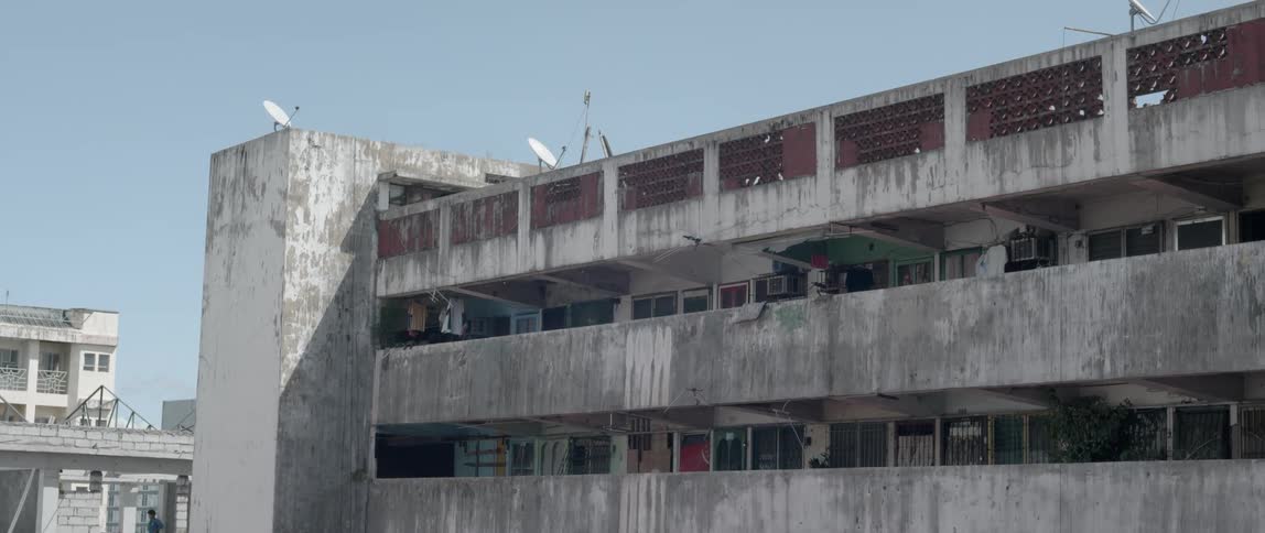 A concrete building stands in a city