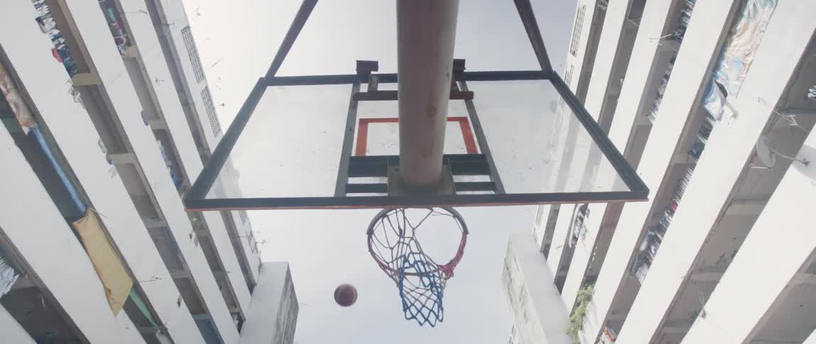 A basketball is thrown into a basketball hoop