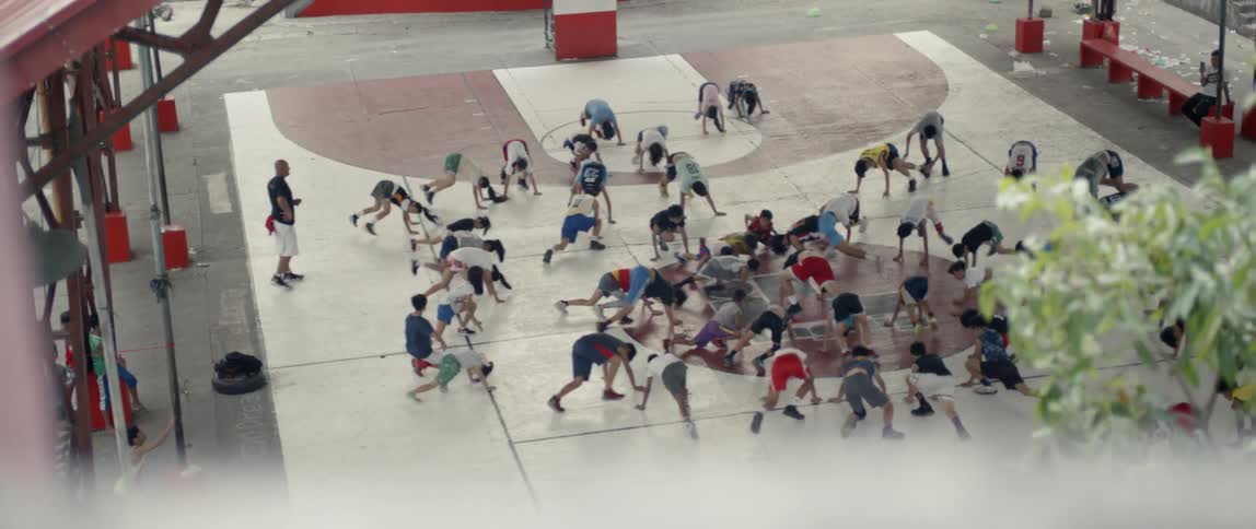 Teenagers warm up on a basketball court