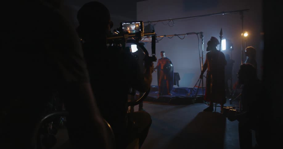 A film crew works in a studio