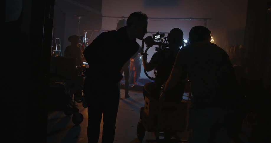 A film crew works in a studio