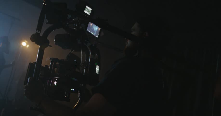 A cameraman films on a film site