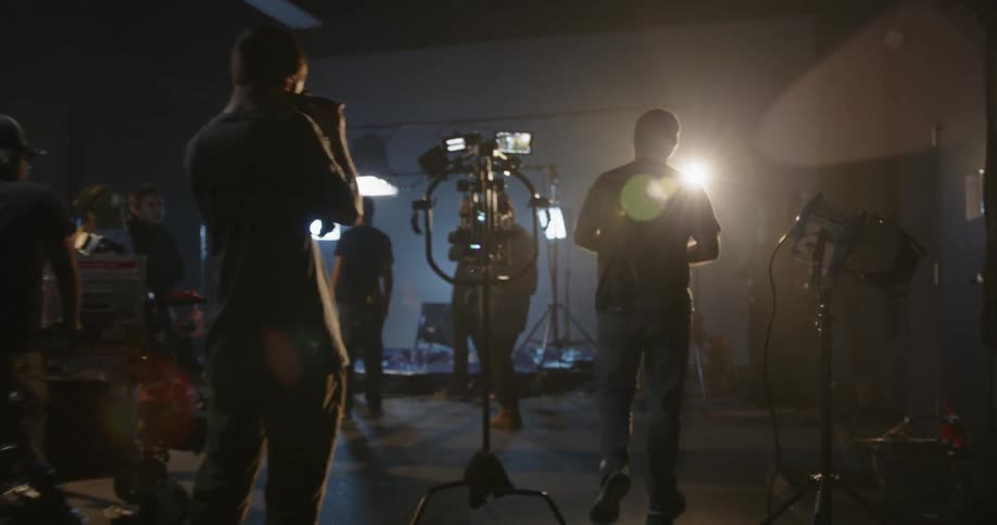 A film crew works in a studio