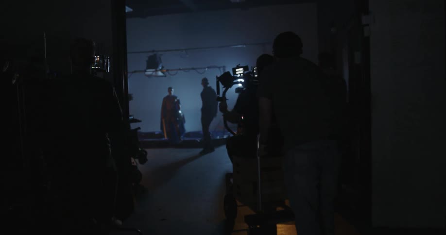 The film crew is recording a scene in the hallway