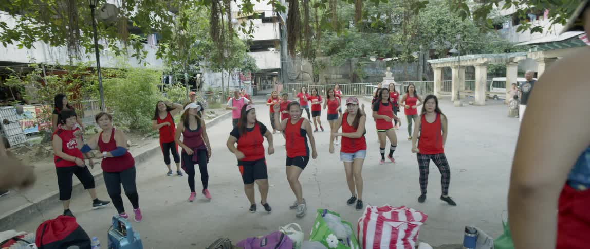 A group of people dance together