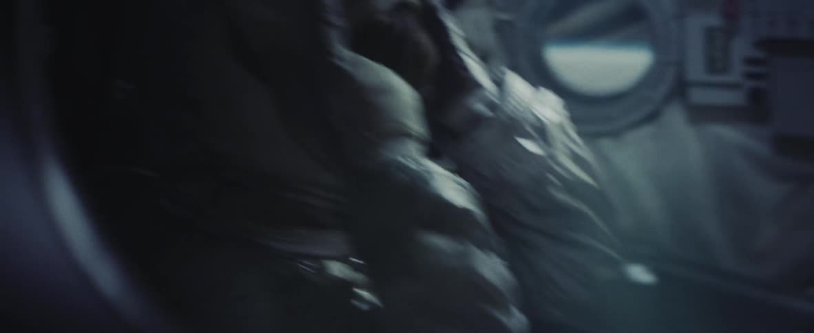 Astronaut adjusting his helmet in a shaky ship