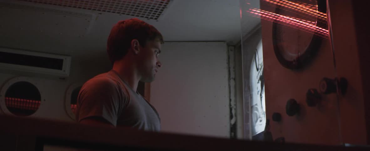Man looks at an image on the wall