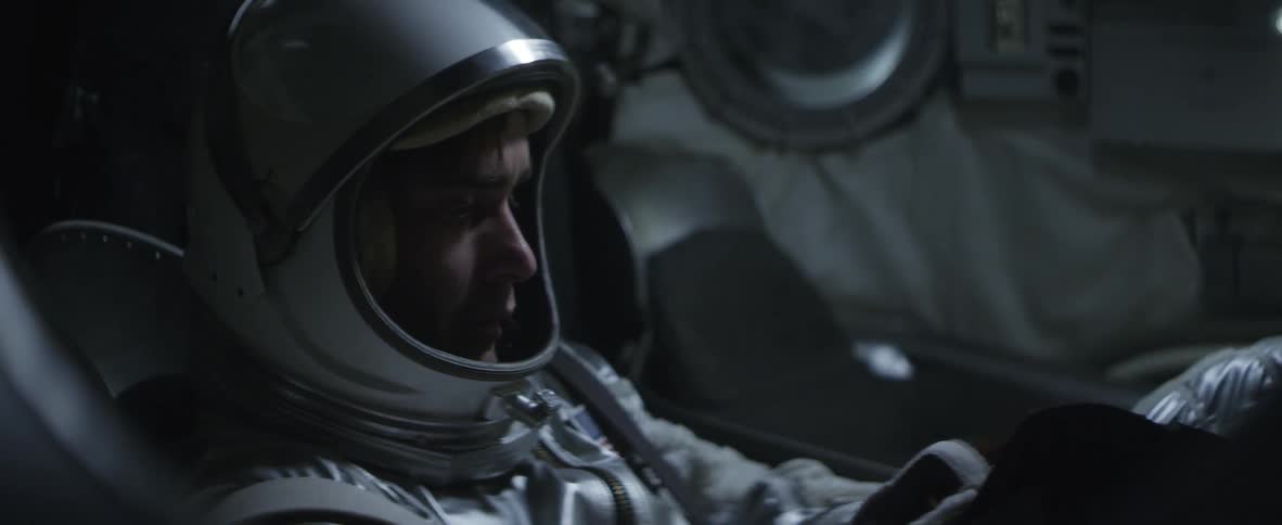 Astronaut writes in a small book