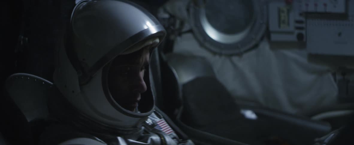 Astronaut sitting inside of a ship