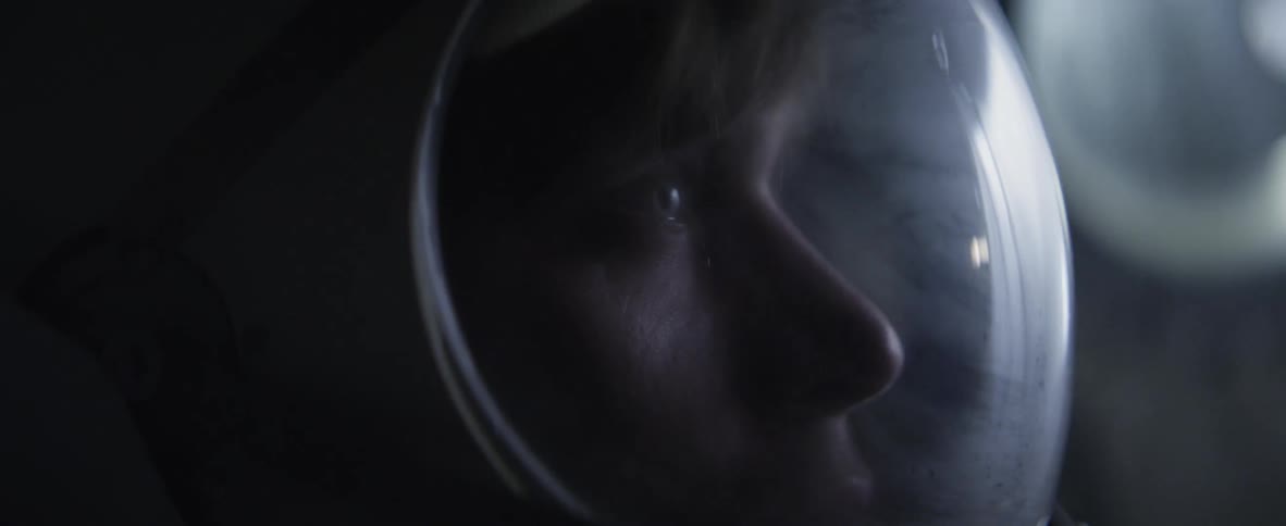 Person wearing a helmet looking forward