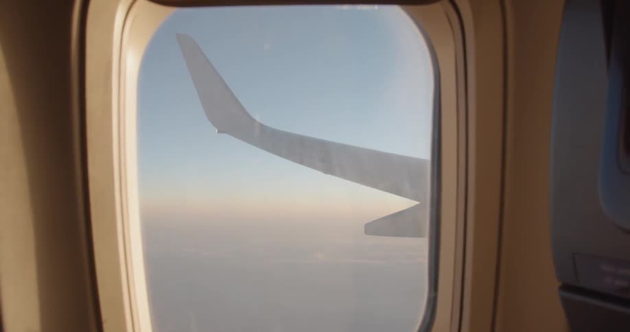 The plane is flying high above the clouds