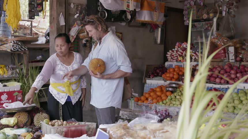 Man buying produce from a woman farmer