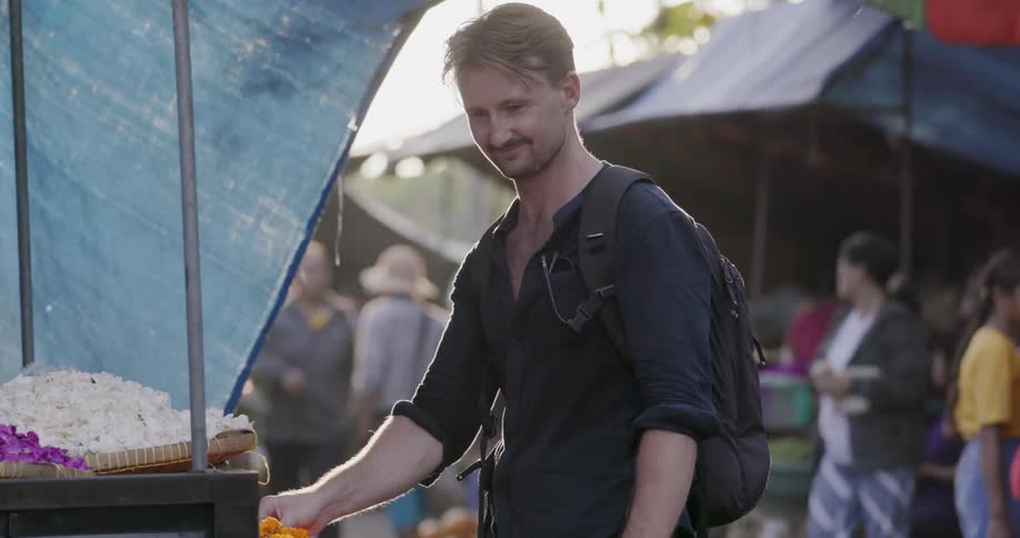 Man shops at an outdoor market