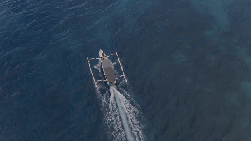 A boat floats on an ocean