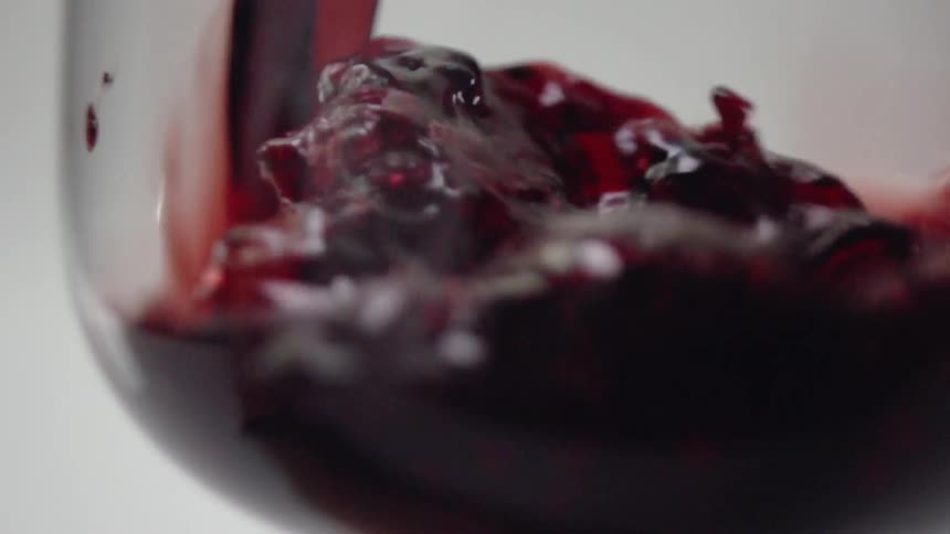 Wine is poured into a glass