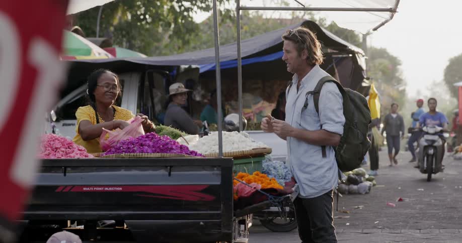 A man haggles with a street vendor