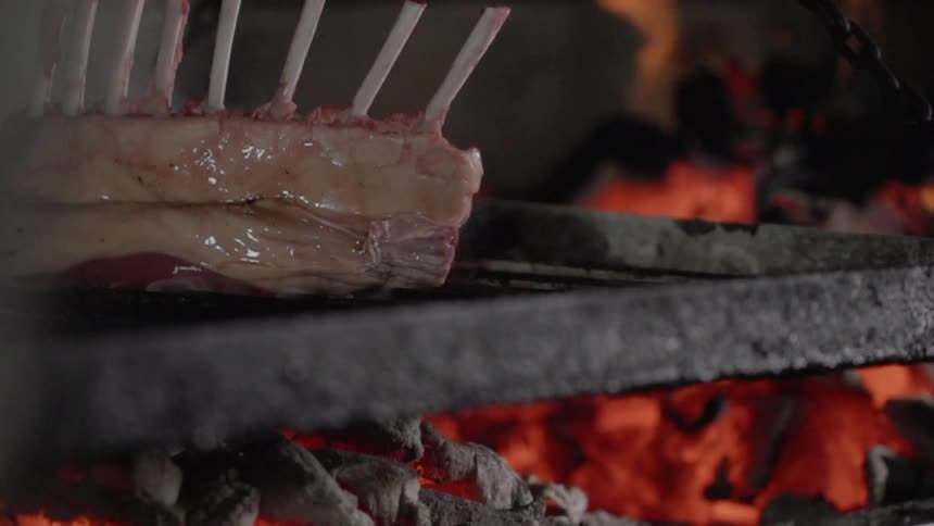 A steak is cooked on a grill