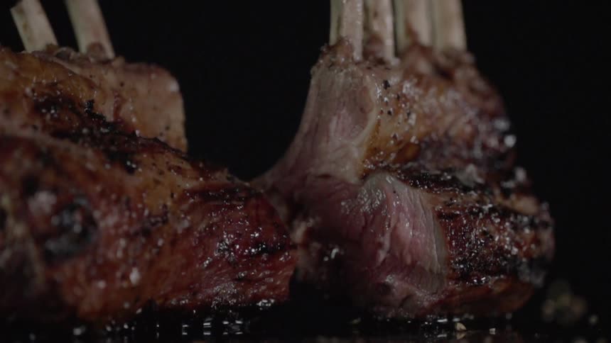 Two chunks of prime rib are displayed on a counter