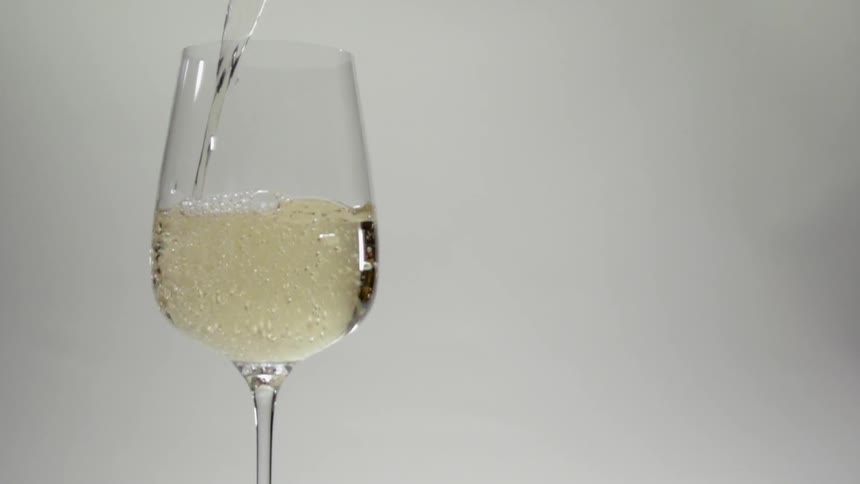Wine is poured into a glass