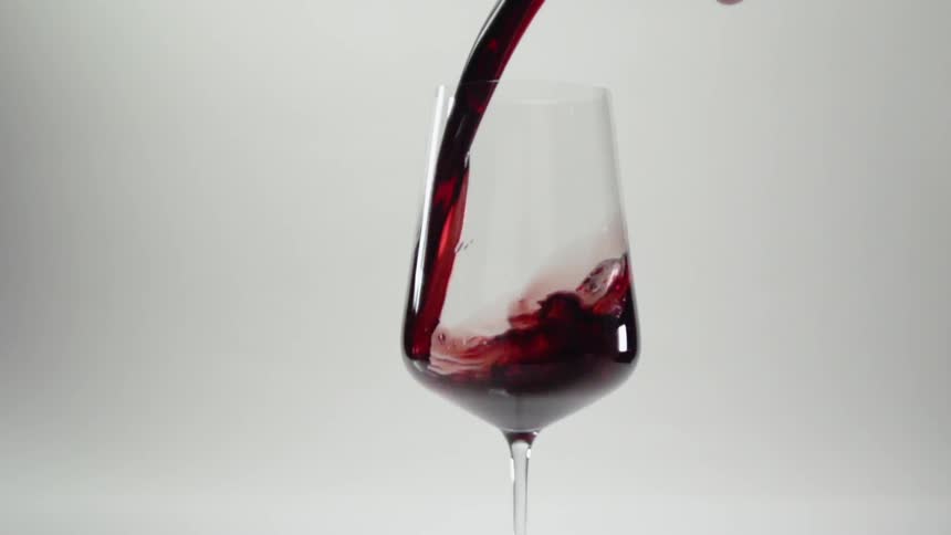 Wine pours into a glass