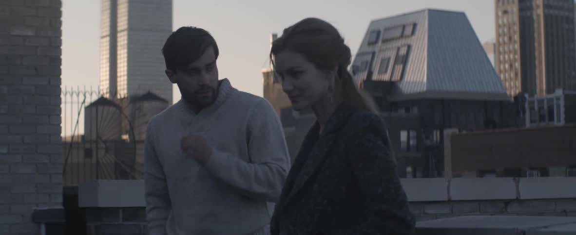 Man and woman meet on a rooftop
