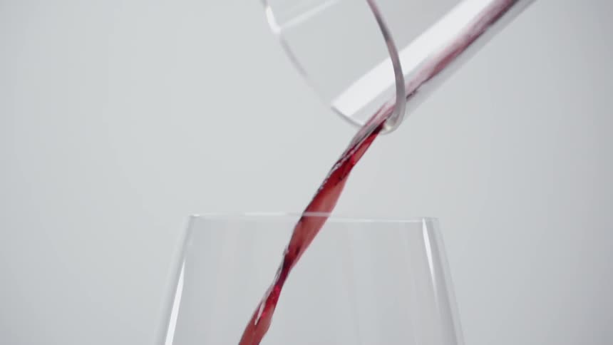 Wine is poured into a glass
