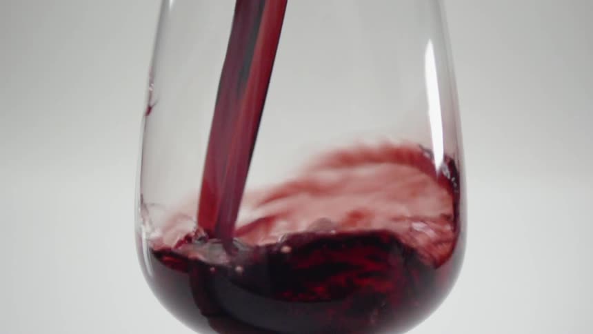 Wine is poured into a glass