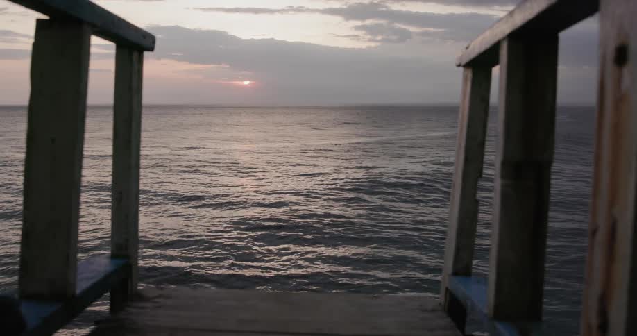 Water ripples on an ocean at sunset